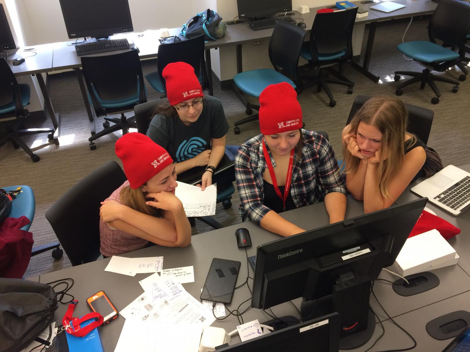 Students looking at a computer screen.